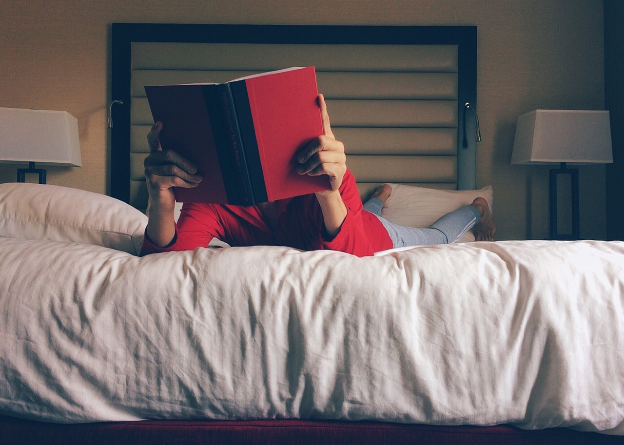 person-reading on bed
