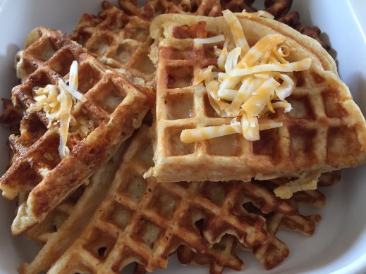 Waffles with grated cheese on top